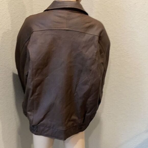 Burks Bay  leather brown coat has a patch on the left side. - Picture 4 of 8